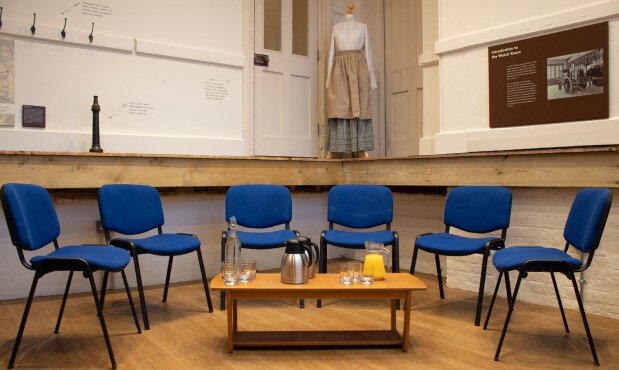 Watch room with small table and six chairs