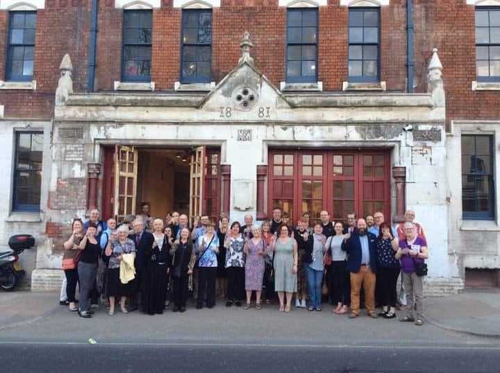 We Are SLT: A crowd of members pose for a group shot outside the Old Fire Station