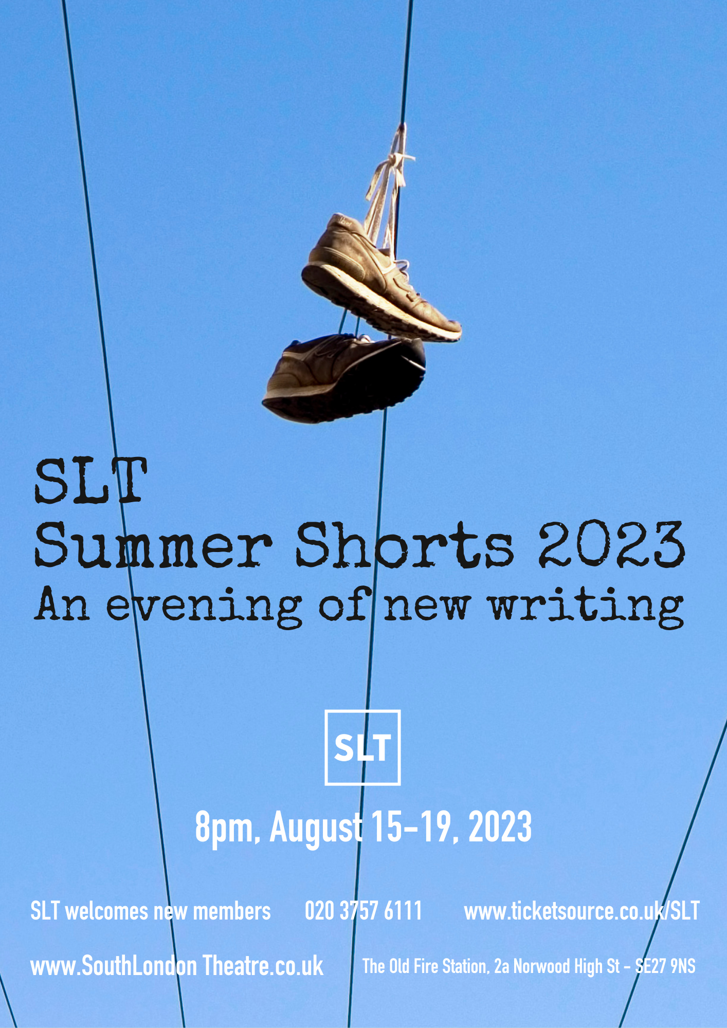 Image of sneaker shoes suspended from an overhead power line against the sky.