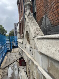 A picture taken from scaffolding at the front of the SLT fire station showing the facade that has been repaired.