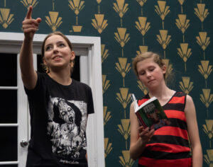 Two young female actors in rehearsal