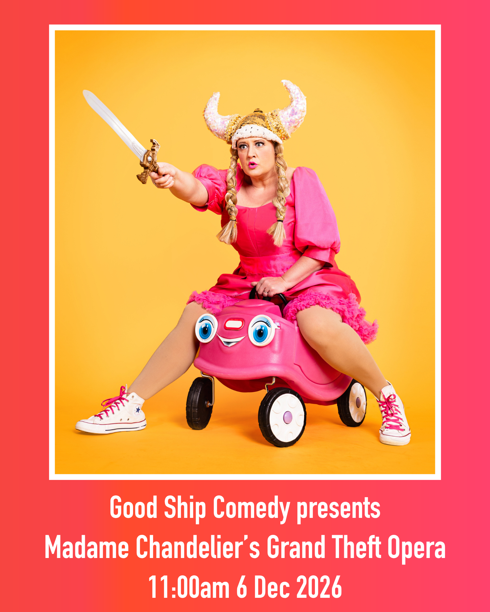 Poster featuring adult comedy character dressed in pink, wearing a horned helmet and bearing a sword, whilst riding a child's pink push-along car.
